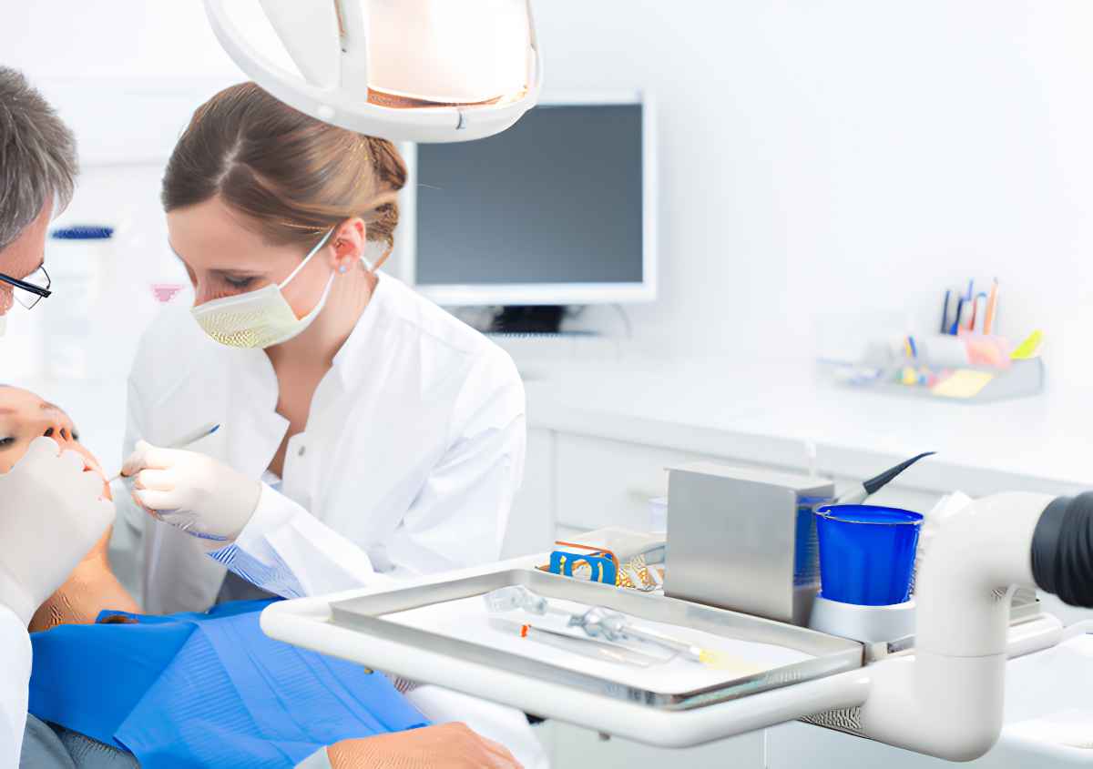 Dentist checking a patient's teeth at Smileville Family Dental Center